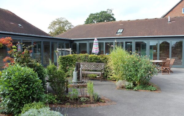 A beautiful old courtyard with some plants and shrubs