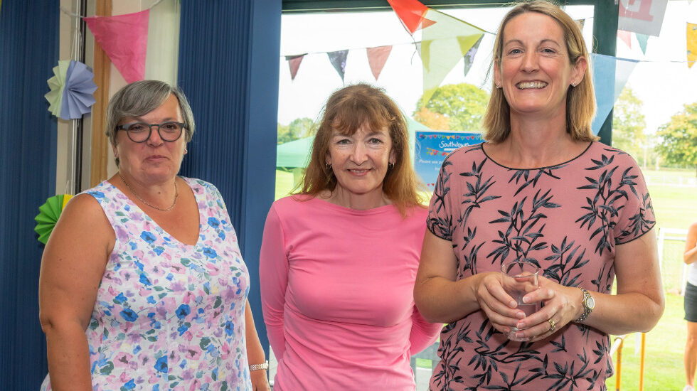 Three of Southdown's Board members are looking at the camera smiling.