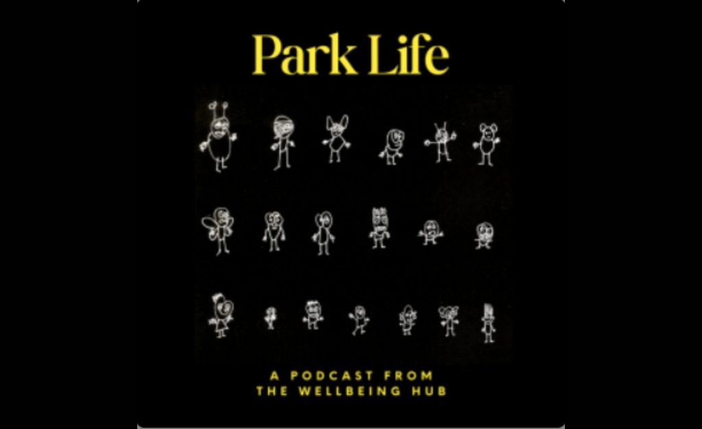 Park Life podcast cover art featuring hand-drawn stick figures with whimsical and unique features, set against a black background. The title "Park Life" appears in bold yellow text at the top, with the tagline "A podcast from the Wellbeing Hub" at the bottom.