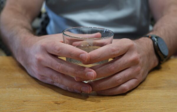 A representative image of an employment specialist's hands holding a drink.