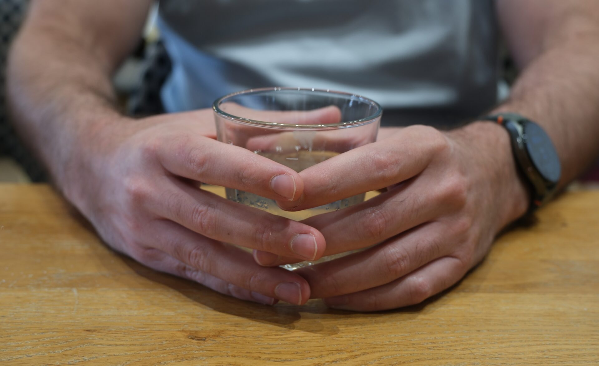 A representative image of an employment specialist's hands holding a drink.
