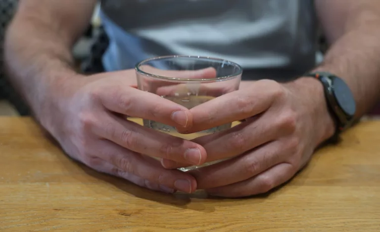 A representative image of an employment specialist's hands holding a drink.