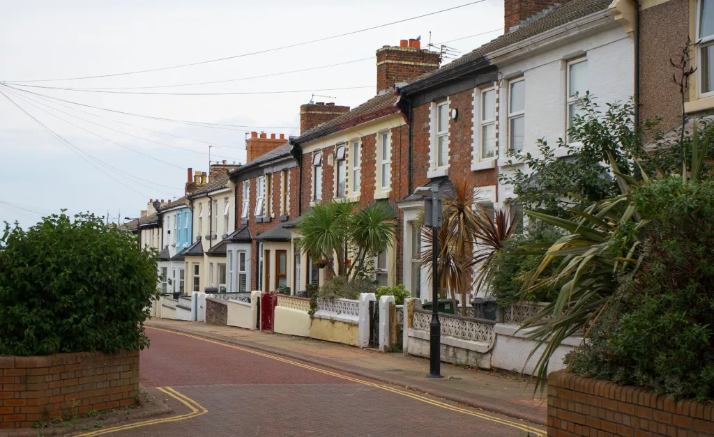 Row of terraced houses on a quiet residential street.